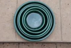 Soucoupe en terre émaillée vert Jade Les Poteries d’Albi - Ø 22 cm